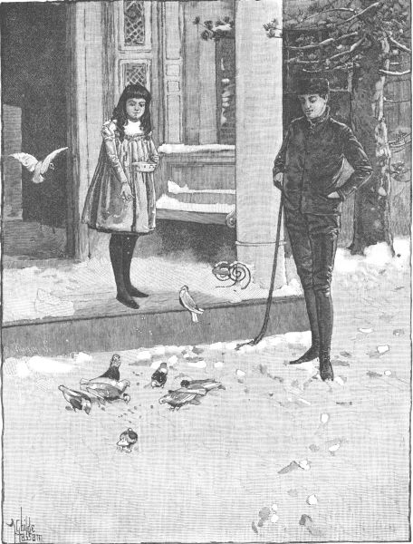 two kids feeding birds